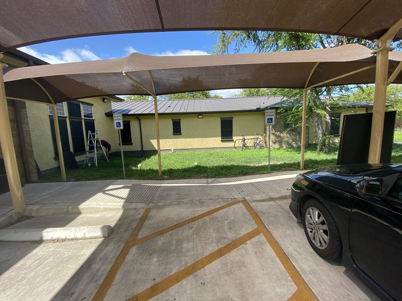 Commercial building solar screens and shade canopy