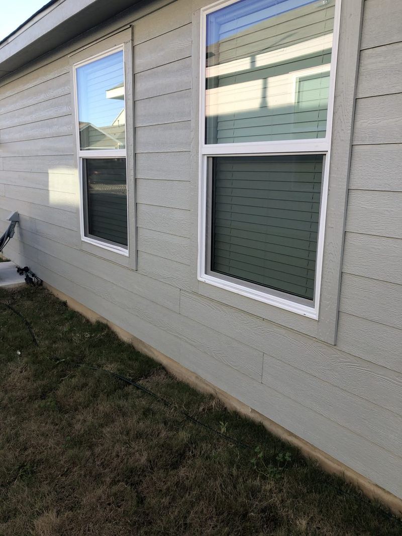 Mosquito screens on siding home